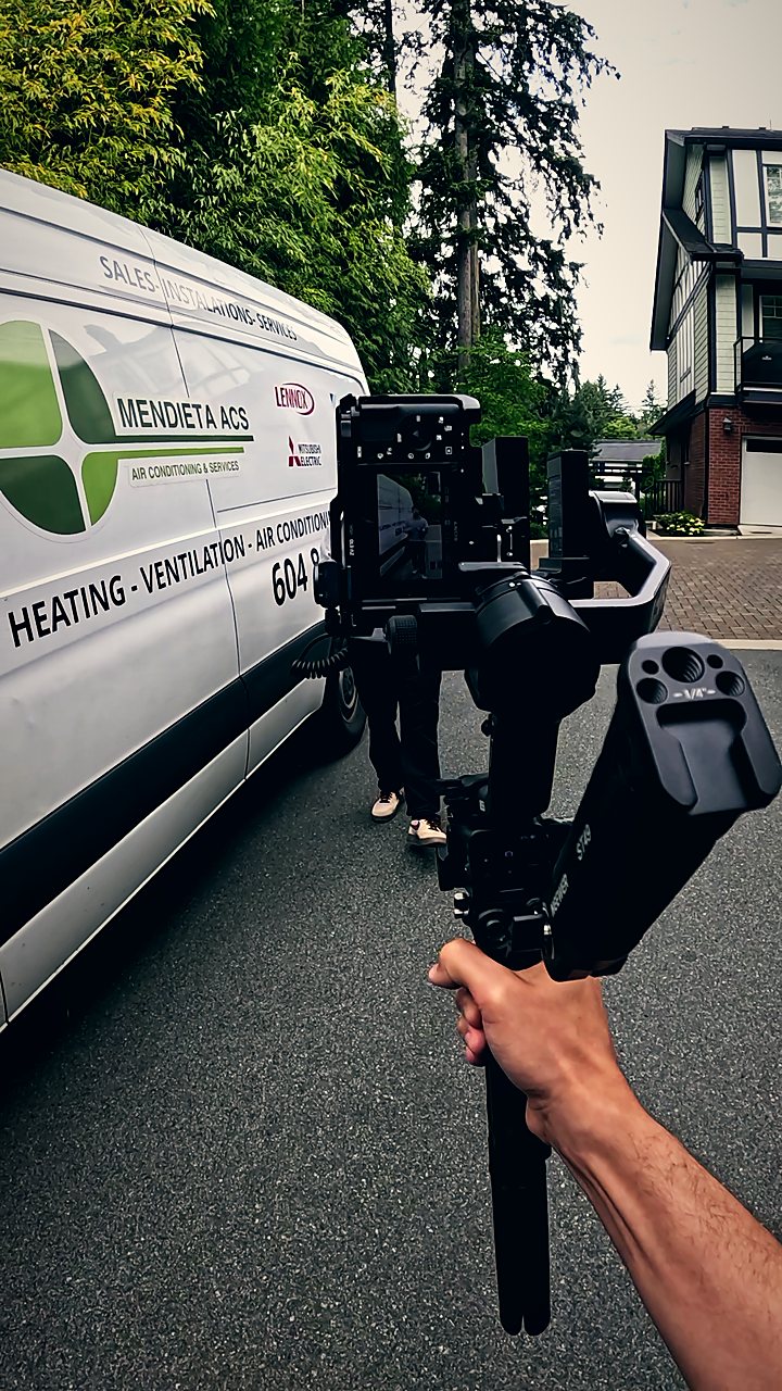 Filming beside a branded HVAC service van