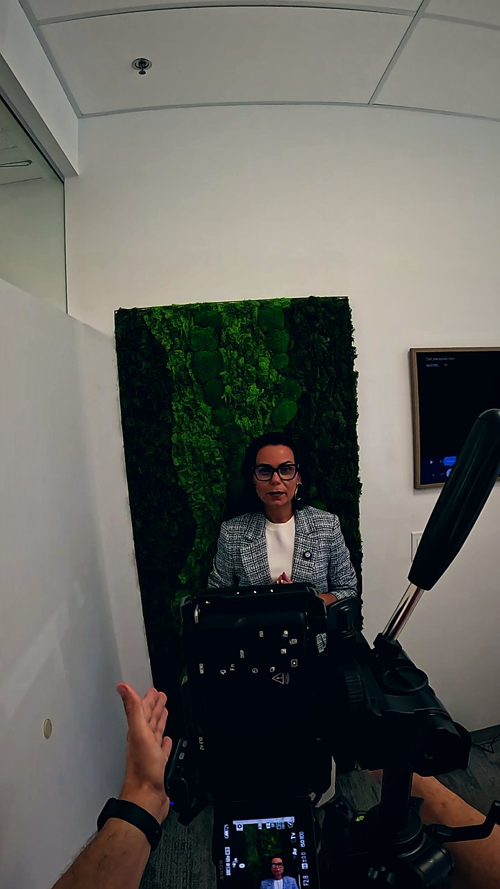 Filming an interview, seen from behind the camera